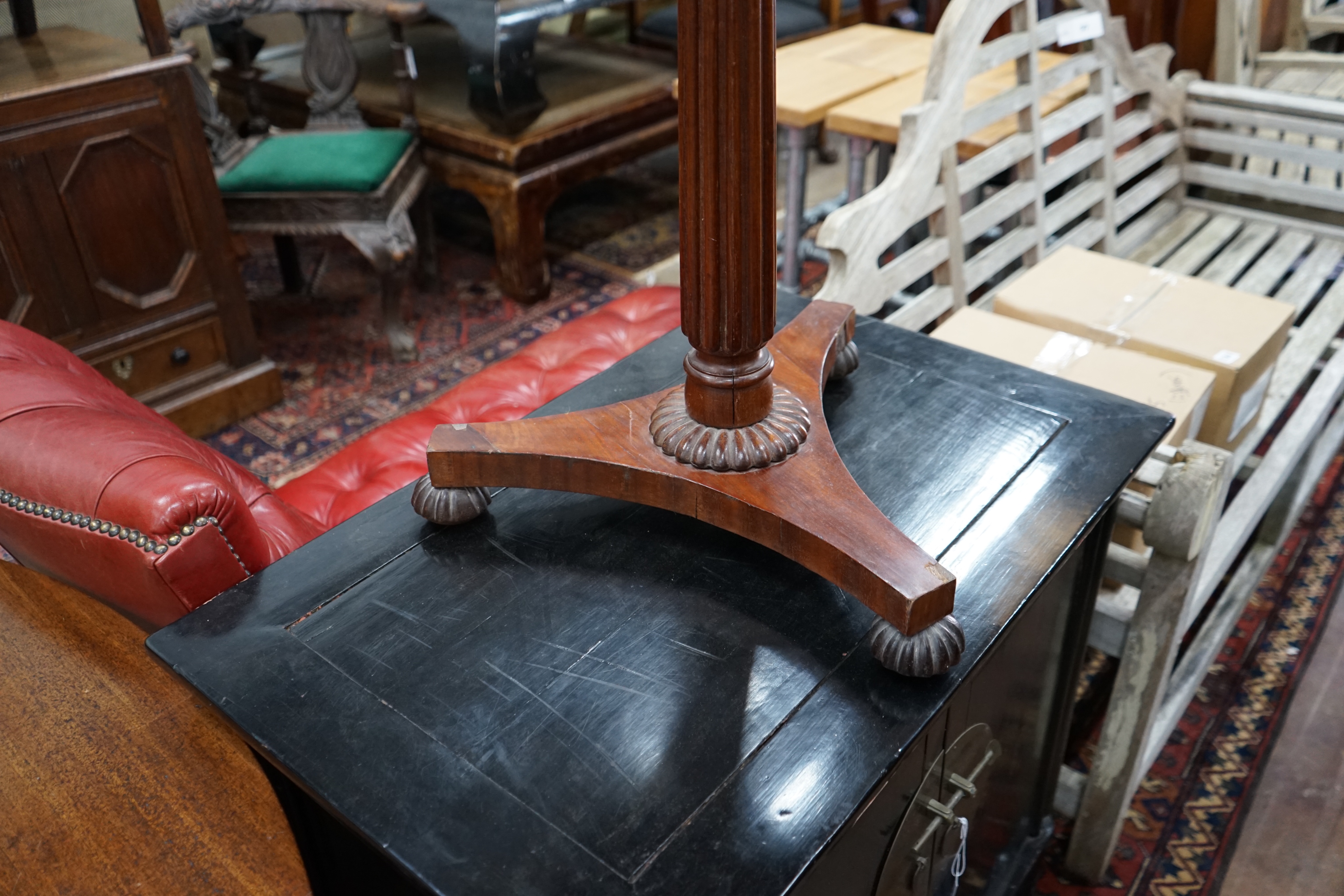 A Gillows style circular mahogany wine table, diameter 50cm height 71cm